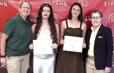Jacianna Heflin and Piper Hayes received the Marcia Smith Memorial Scholarship in the amount of $500 each from CUHS Instrumental Music Assistant Director, Christine Lovell and Instrumental Director Gae Phillips during the Senior Assembly, May 15, at the Columbus Unified High School Gymnasium.