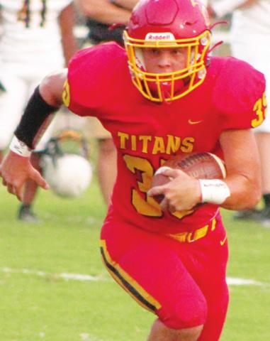 Titan Senior, Trent Smith, picks up yardage against Coffeyville in the 40-8, Columbus win, Friday at Titan Stadium. The Titans are in action tonight at Girard.