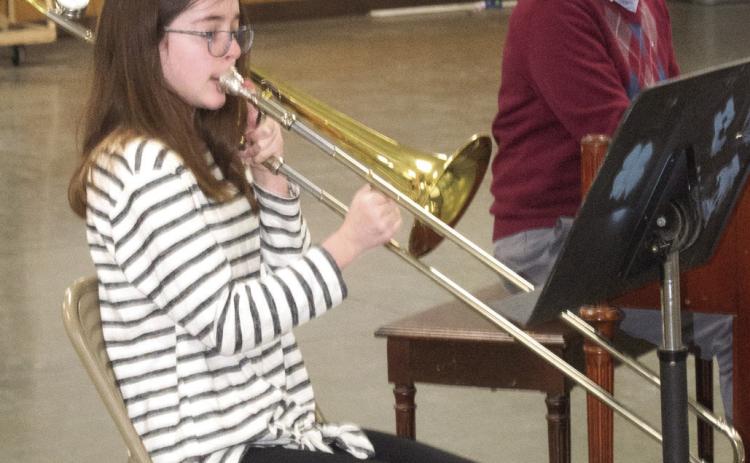Performing a trombone solo for the judges, Kora Welch was participating in Cherokee County 4-H Days. Gae Phillips accompanied Welch on piano.