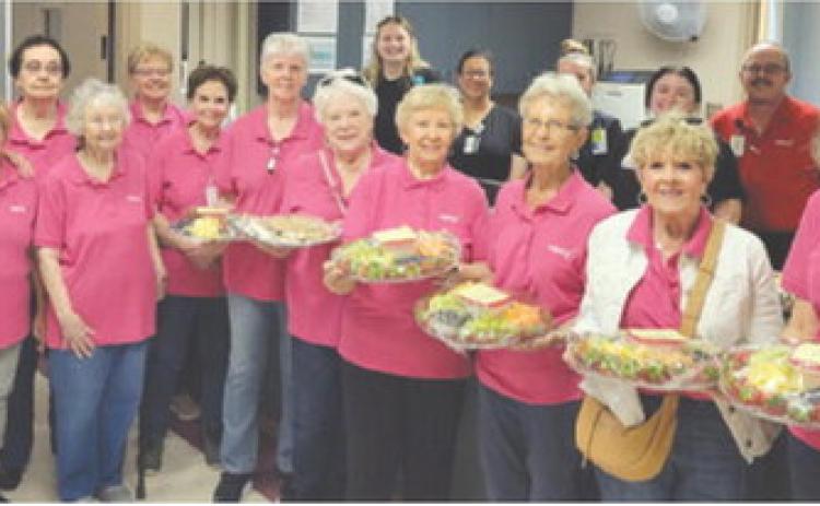 Members of Columbus’ Mercy Auxiliary delivered fruit trays and cookies to staff at the Columbus hospital. The group was celebrating Hospital Appreciation Month. Courtesy photo.