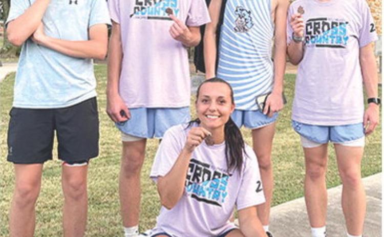 Members of the Southeast Cross Country Team ran away with five medals, four season bests, and one career best time at the Girard Invitational Meet, Thursday at Greenbush. Runners earning medals are James Maxton, Tucker Sutton, Chris Archey, Hudson Locke and Jackie Robinson in front. Photo by Julie Jones