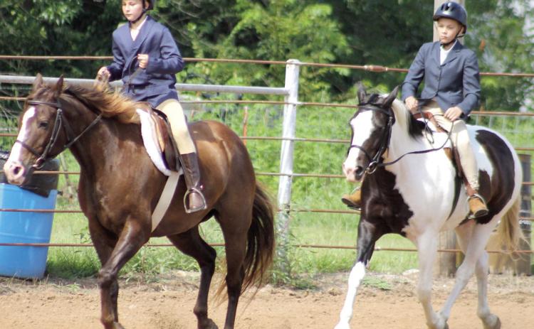 Elizabeth King and Samuel King members of Heritage Youth Association participated in the Hunt Seat Under Saddle class at the Cherokee County pre-fair horse show Saturday, July 11.
