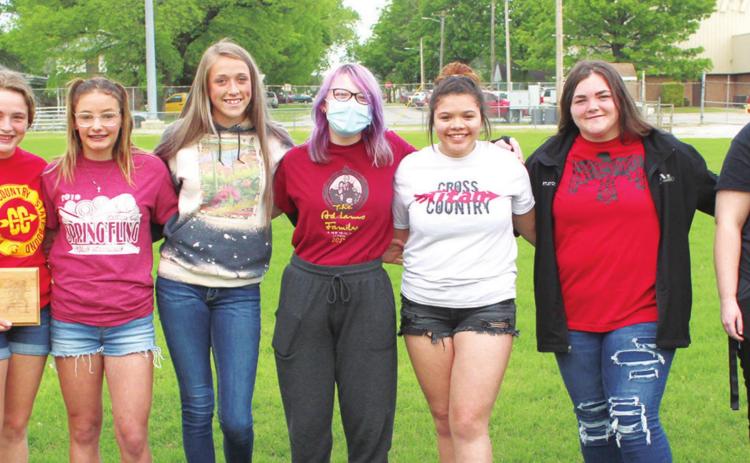 The Lady Titan Cross Country Team was introduced and recognized during the Annual Titan Booster Club Award Ceremony, May 5 at Titan Stadium. Head Coach Luke Henke introduced senior, Dixee Lacen, freshman, Sophie Lloyd, sophomores, Montana Ohmart and Ella McElroy, junior, Erin Lima, managers, Kaitlynn Hunt and Rylie Head and sophomore, Korri Combs were present for the event. Not pictured senior, Avery Campbell and sophomore, Maddie Buergin.
