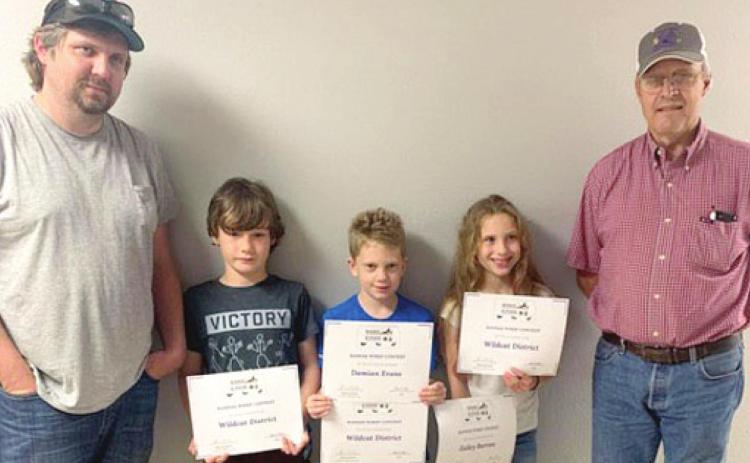 Recently Wildcat District 4-H members competed in the Kansas Wildlife Habitat Education Program. Left to right are Coach Brian Elsworth, Raylan Elsworth, Damien Evans, Zailey Burrow and Coach Dan Peterson.
