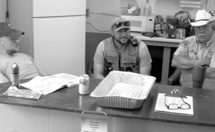 Taking a break while the students enjoy breakfast at the Hunters Safety Course, the three Conservation Officers were discussing changes in the conservation law during the recent legislative session. The officers are Austin Seoers, Colby Austin and Jim Bussone.