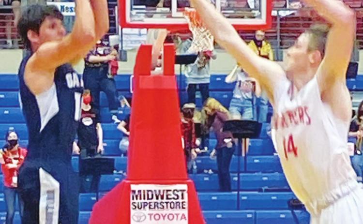 Galena Bulldog Junior, Brett Sarwinski, shoots for three points over a Hesston Swather in the Kansas Class 3A State Championship game, Saturday in Hutchinson. Sarwinski led all scoring with 19 points in the 45-36, Galena loss. Courtesy Photo.