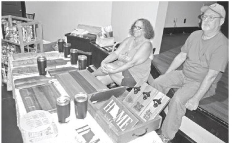 Home items made by John and Heather DePratt were available at the Chamber of Commerce Business Expo. Wooden cutting boards candles and etc. Handling the sales in the booth were Terri and Jay Beech.