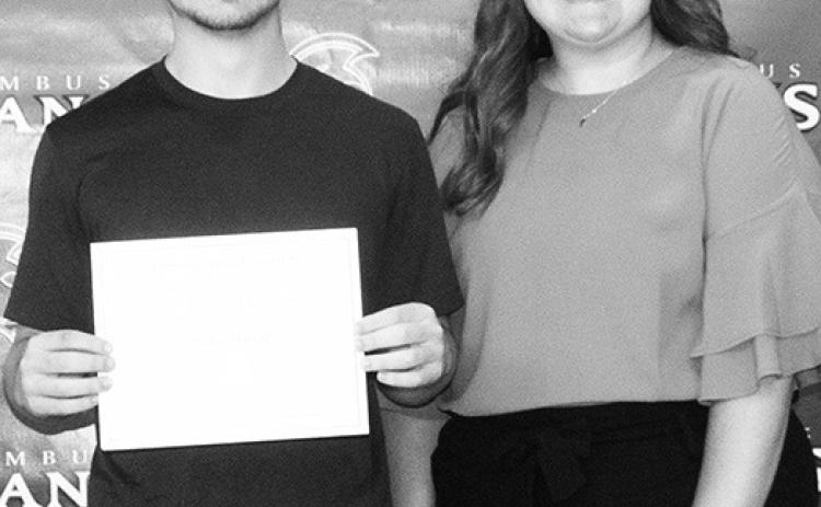 Kyler Baylor received a $1,000 Academic Achievement Scholarship from Pittsburg State University during the May 20 Senior Awards Assembly at the CUHS Gymnasium. Anna Farrow, PSU representative presented multiple scholarships to Columbus High School students.