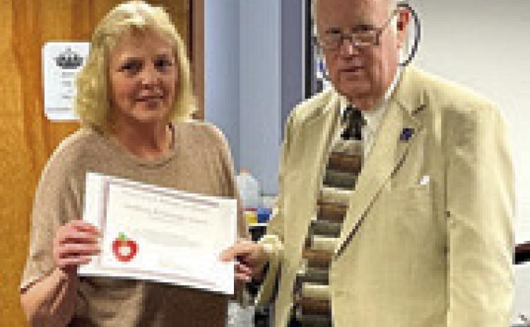 A Challenge Award was presented to Southeast Elementary School Principal Tammie Hall by Kansas State Board of Education member Jim Porter. Courtesy photo.