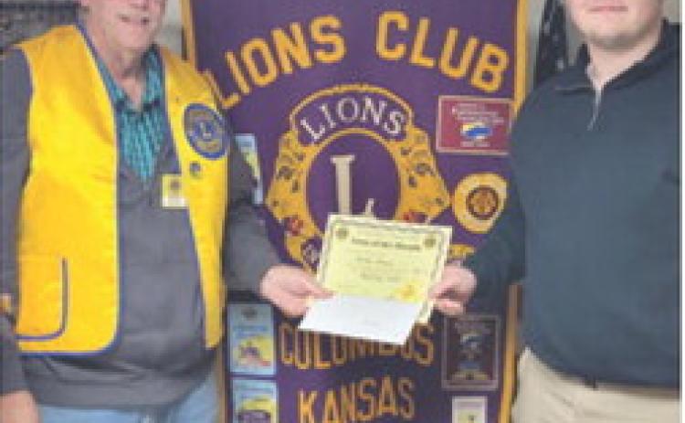 Carter Henry was presented his Lion of the Month certificate by Columbus Lions Club President Brad Gleason. Courtesy photo.