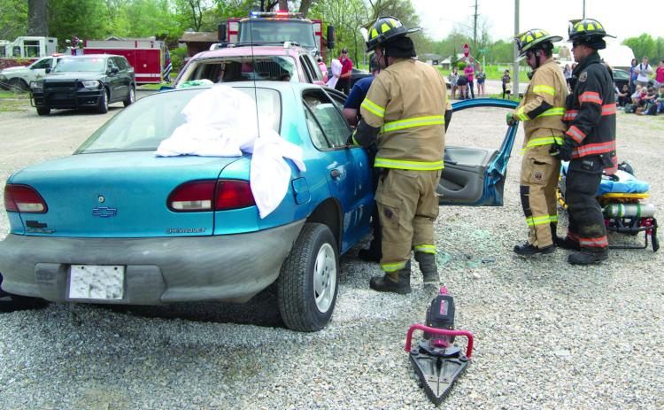 In the beginning Columbus fire fighters survey the extent of the accident and the condition of the vehicle occupants. They used their extrication equipment to get the students out.