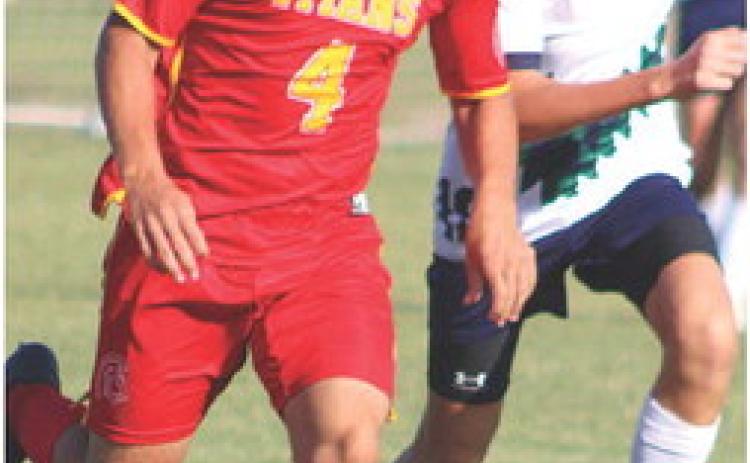 Titan Dallas Scott drives the ball toward the Liberty Home School Goal during a recent match on the Central School home pitch. The Titans are still looking for their first win.