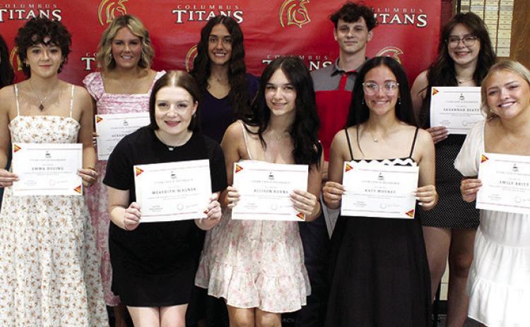 Members of the Senior Class receiving Titan Cafe Scholarships are front row: Meredith Wagner, $350; Allison Burns, $650; Katy Mooney, $650; and Emily Britt, $350. Back row: presenter, Laura Boeckman, CUHS Instructor/Presenter; Emma Duling, $350; Kenadie Carter, $650; Brylie Johnson, $650; Jaiden Gannaway $650; and Savannah Beaty, $350. Scholarships were presented during the Senior Assembly, May 16, at the Columbus Unified High School Gymnasium.
