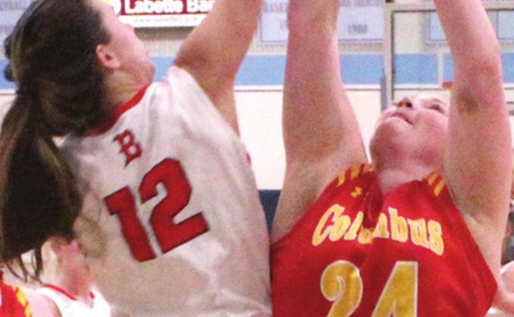 Lady Titan Senior, Bailey Monroe is fouled by Lady Lion Senior, Kennedy Krokroskia, in the 44-33 Columbus loss at the SE Lancer Classic opener, Monday. Bailey made 10 of 14 free throws in the game.