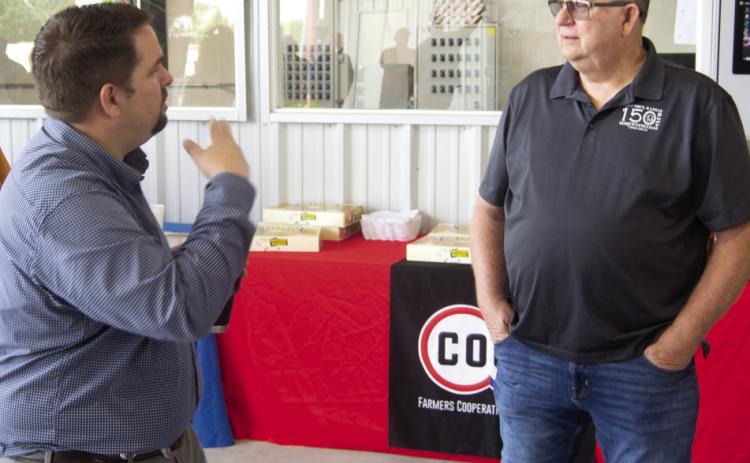 Matt Case with Farmers Coop talked with Mayor Grant Spieth at the May Third Thursday Coffee. Chamber members gathered to see what was new at the Agronomy Center.