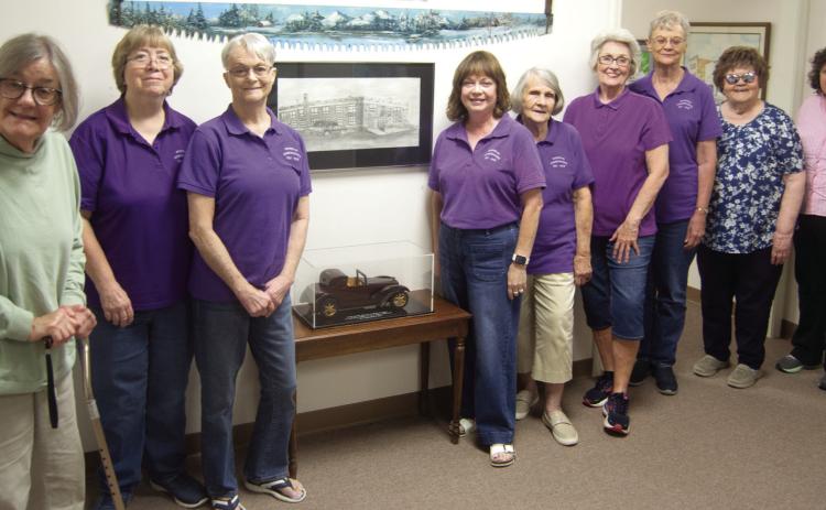 Members of the Sheridan Homemakers held their recent meeting at the Columbus Museum. The group toured the facility and stopped to look at the hand made car, created and donated by Leroy Barrett.