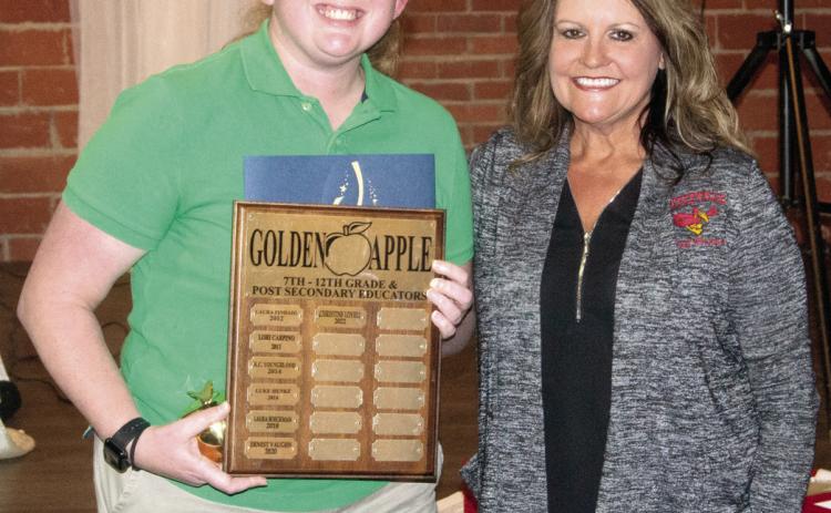 The Post-Secondary Golden Apple award was presented to Band Teacher Christine Lovell by Chamber Education Committee Chairperson Kari Soper.
