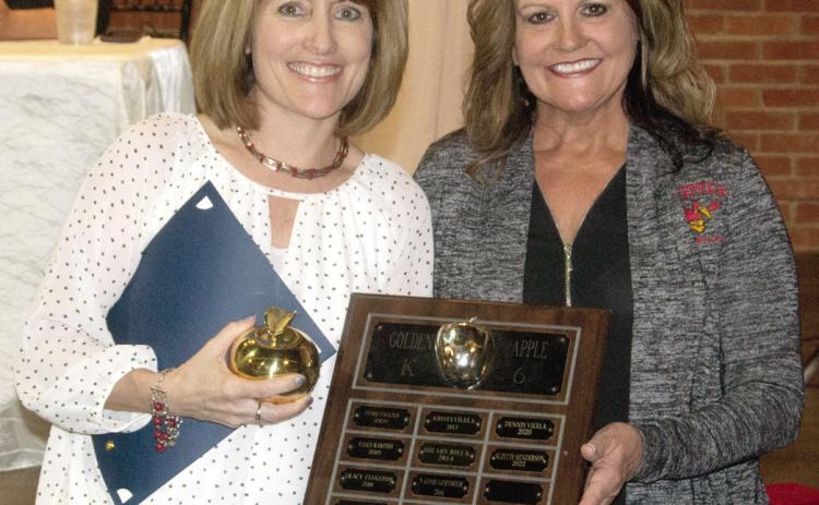 The Elementary Golden Apple award was presented to Kindergarten teacher Suzette Henderson, by Kari Soper at the Columbus Chamber banquet Wednesday evening.