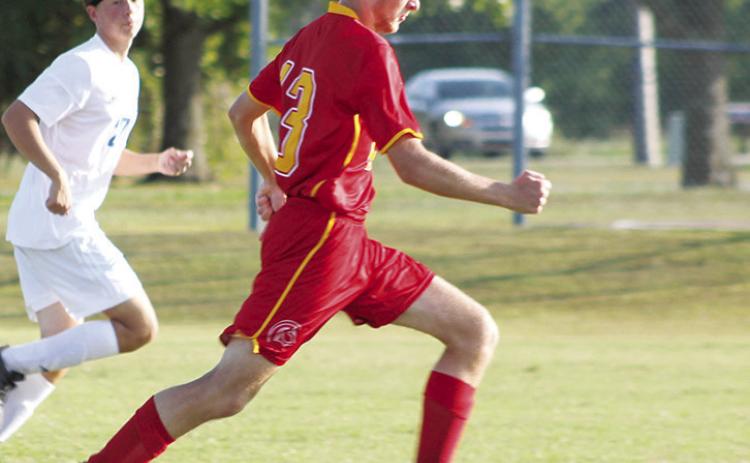 Titan Senior, Cody Ediger, pushed past a Parsons defender to score a goal in Tuesday’s home soccer match at the Central School Pitch. Parsons won 9-1.
