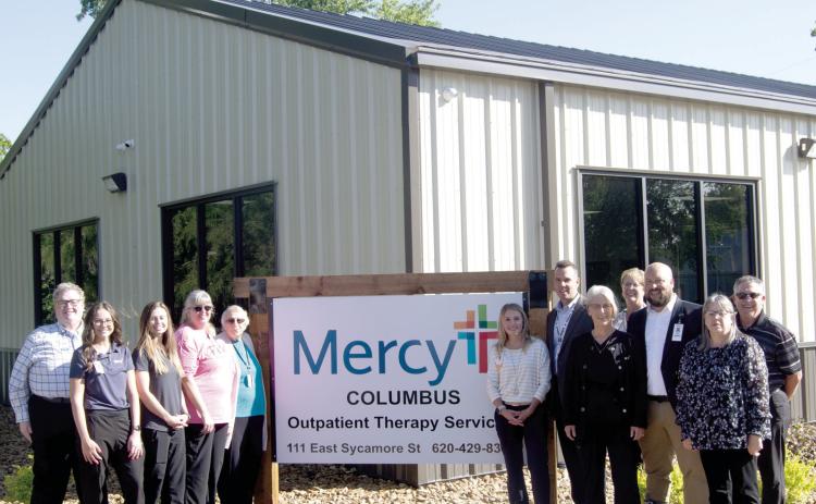 Mercy associates, management, board members and corporate staff joined around the Mercy Columbus Outpatient Therapy sign during the ribbon cutting ceremony. A large turnout welcomed the new feature to the local hospital.