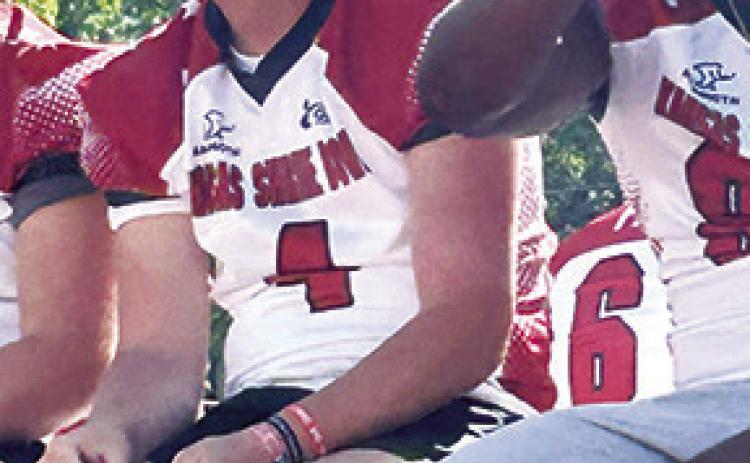 Columbus Titan 2025 Graduate, Jace Midgett, rode the float with his East Team mates during the 52nd Annual Shrine Bowl Parade, Saturday morning, prior to the bowl game, that evening. Courtesy photo.