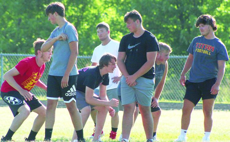 Titan Linemen work on technique during drills at the recent team camp. Senior, Rydge Delmont, right,was a second team All-District and All-CNC League selection in 2021. Seniors Jake Eddington and Fischer Troxell will help anchor both the offense and defense with returning sophomores, Carter Henry, Brandon Stice, and Owen Roberts with the addition of freshman, Luke Breeden.