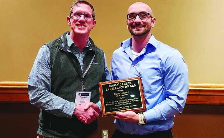 Taggart Wall, Winfield City Manager presented Columbus City Administrator Jake Letner with a plaque signifying his “Early Career Excellence” from the Kansas Association of City/County Management. Letner received his plaque during the [KACM] Annual Conference was held in Dodge City