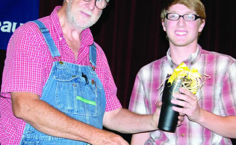 The Paul Schmidt Memorial Farm Bureau Scholarship was awarded to Jacob Scott. He had already received the scholarship, but received a gift and an introduction to those present.