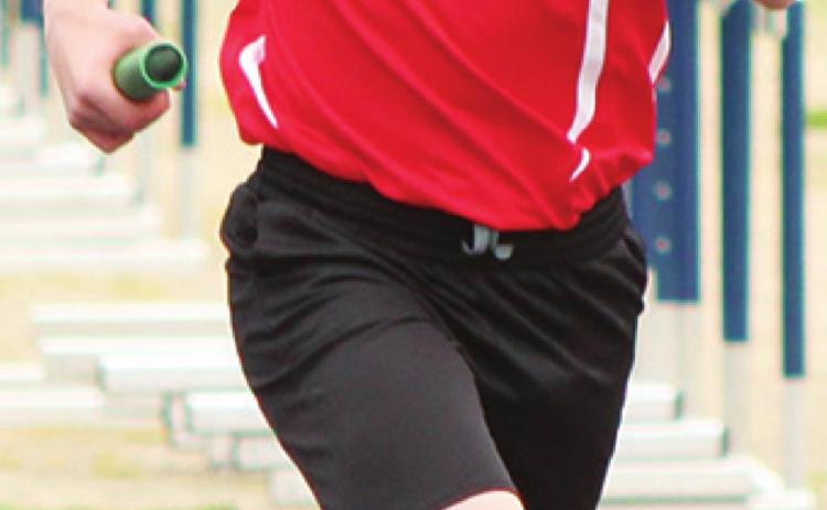 Central Titan Eighth Grader, Syler Schuberger, carries the baton in the Spring Medley at a meet in Galena. Schuberger and his Sprint Medley Relay Team of Landin Midgett, Brandon Stice, and Evon Mayfield won first place in the Girard Invitational Meet, Thursday. Syler placed fifth in the 400 Meter Dash with a time of 62 seconds.