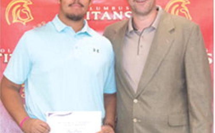 Rece Ponce received a Football Scholarship from Butler Community College in the amount of $12,000 during the Columbus Unified High School Senior Assembly, May 16, at the CUHS Gymnasium. The scholarship was presented by USD 493 Instructor, Matt Crain.
