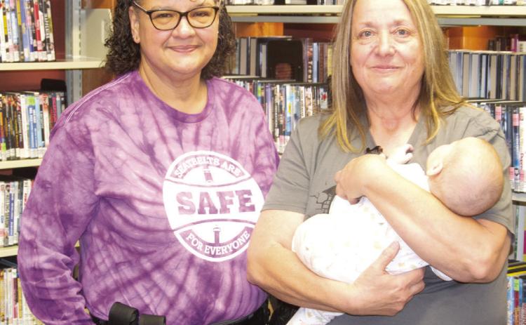 Deputy Sheriff Anne Sharp and Library Director Bonnie Palmer discussed the program at the Saturday morning Family Engagement in public libraries. Deputy Sharp talked on the proper use of car seats for children.