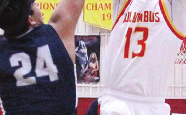 Titan Junior, Kolt Ungeheuer, drains one of his baskets against junior, Ty Hall, Galena, in Tuesday’s CNC League loss at the Columbus High School Gymnasium, 61-45. Kolt had a team-high, 15, points.