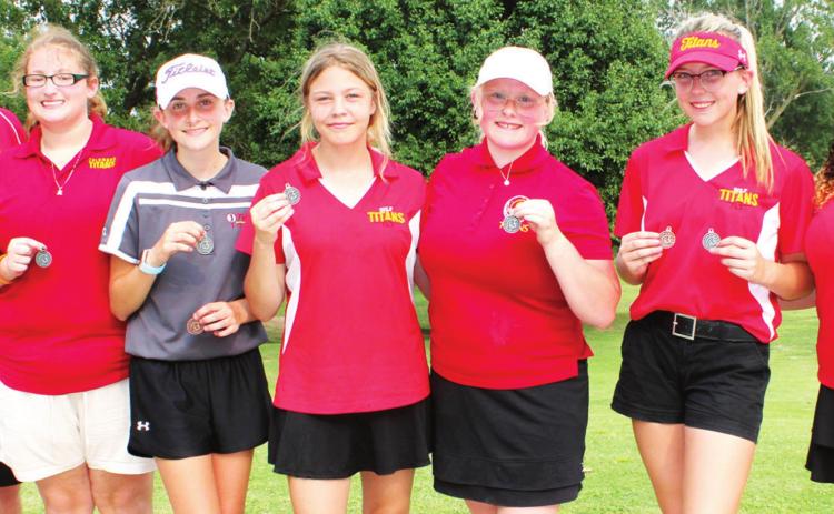 The Columbus Lady Titan Golf Team placed second at the Columbus Invitational held at the Brush Creek Golf Course, Thursday. In addition to the second place team finish, sophomore, Reese Grundy placed sixth to medal with a 51 on the nine-hole course and freshman, Mallory Thompson played tenth after winning a tie breaker, shooting 60 on the day. Team members are: Coach Ernie Vaughn, Alyvia Soper, Mallory Thompson, Kenlyn Christiansen, Hannah Daniels, Reese Grundy and Destiny Lima.