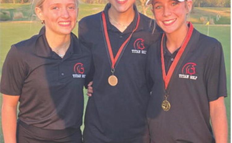 Lady Titan Eighth Grader, Tyler Kirk, (right) won the girls division of the 2026 junior high golf opener with a round of 49 at the Independence Country Club, Monday. Kip Saporito (center), CJHS Eighth Grader, placed seventh with a 65 to help lead the co-ed team to a fourth place overall finish. Fellow eighth grader, Raylee Engroff, rounds out the Lady Titan members of the team. Columbus will be back in action Monday in Pittsburg starting at 2:30 p.m. at the Four Oaks Golf Course. Courtesy photo.