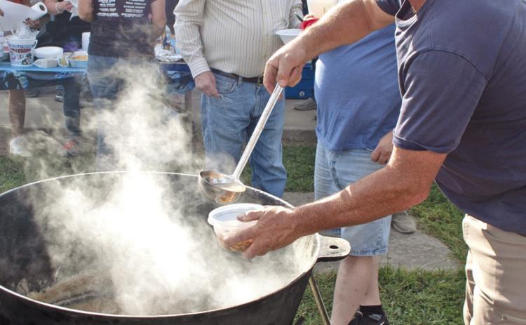 The 89th annual Weir Homecoming has become famous for their large pots of chili and beans served free to the public. The chili and beans have been served free to the public for more than 50 of those years. Stirring the pot David Jenkins served more than 150 servings to an appreciative audience.