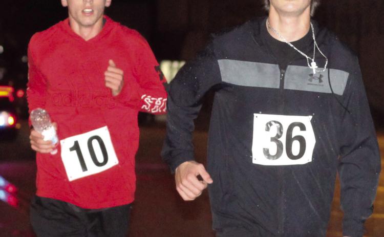 The annual Titan Band and Team Threads Zombie 5K was held Saturday. Derek Krause, number 36, was Overall first place male and he placed first in the 19 and under boys division. Levi Simpson, number 10 placed second in both categories. Whitney Osborn, not pictured, was the overall women’s winner.