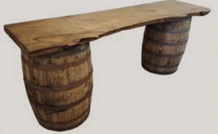 In its most basic form, a saloon might be created with a wooden plank resting atop two barrels in a tent. Courtesy Kansas Historical Society.