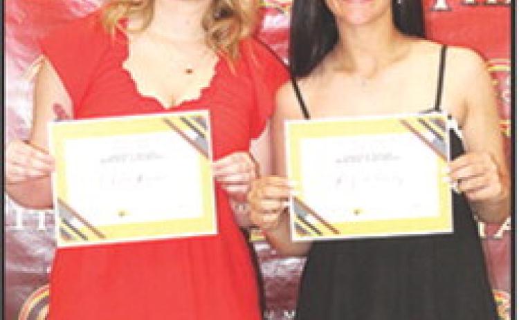 Chloe Rogers and Katy Mooney received the Sandra B. Houser Columbus Community Foundation Scholarship in the amount of $1,000 each at the Senior Assembly, May 16, in the Columbus Unified High School Gymnasium.