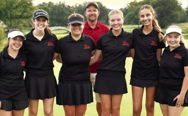 The Lady Titan Golf Team took first place in the St. Mary’s-Colgan Invitational at Crestwood Country Club, Thursday, in Pittsburg. The team won the team title by 13 strokes over their host Lady Panthers. Team members are: Hannah Noel, Natalie Wary, Fallon Smiley, Coach Jerry Smiley, Cali Carpino, Addison Johnson, and Amory Neely. Courtesy photo.