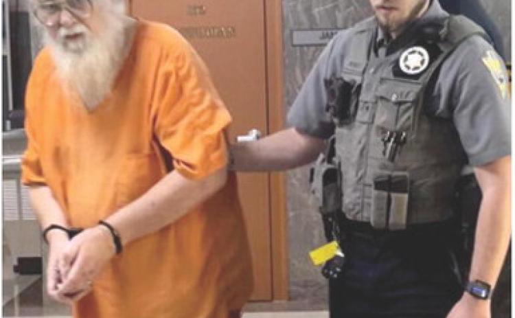 Cherokee County Deputy Alex Duckett escorts convicted sex offender John Clark from the courtroom Wednesday after Clark received four life sentences in the Kansas Department of Corrections. Courtesy photo.