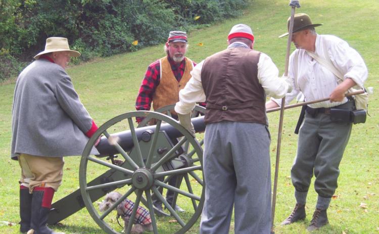 Getting ready to fire the cannon during the encampment last year at the Baxter Springs Chamber of Commerce and Heritage Center Civil War Encampment. An encore event is planned for the first week-end in October.
