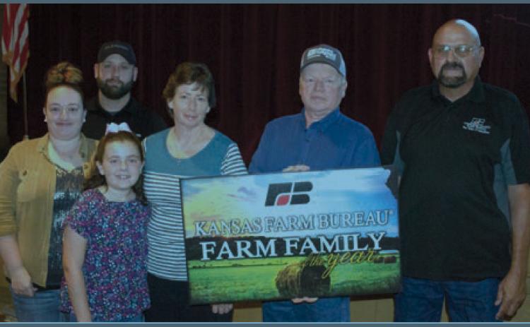 Accepting the Farm Family of the Year award with Kenney and Linda Griffitt were Paul and Lindsey Morris and Ava.