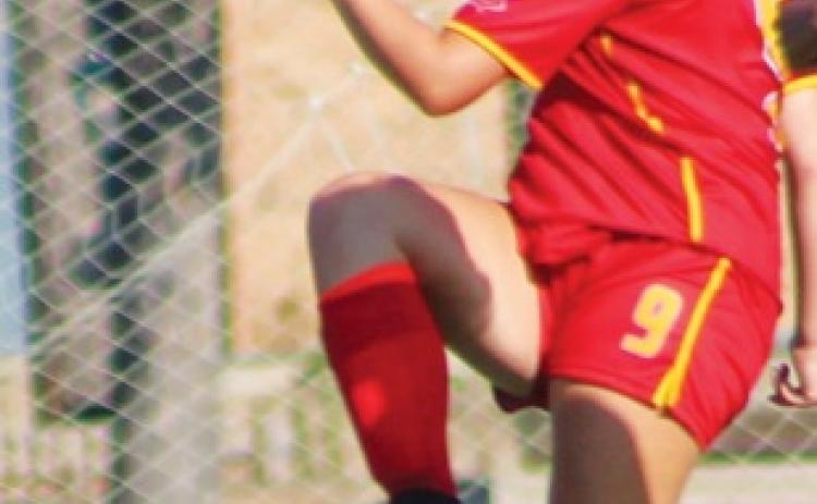 Trojans squeak past  Titan Junior Varsity