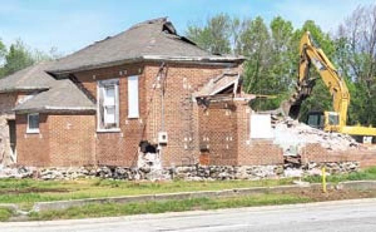The Crestline Community Center is no more as it was razed by wreckers last week. The building had been a school, when the school closed it became a community center and continued to be a meeting place in the community for over 100 years. Photo by Danny O’Hara.
