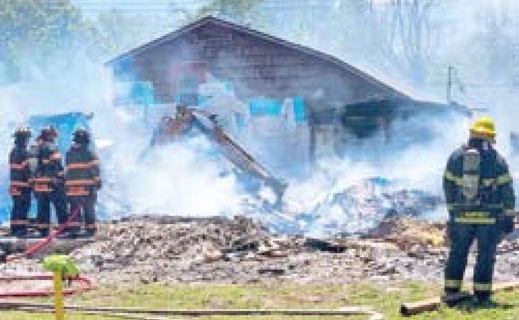 Columbus Fire Department was busy fighting a fire Sunday. Wind caused debris from a controlled burn into an adjacent house. Photo by Midwest Emergency Photography.