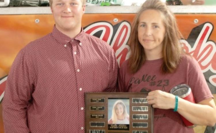 Traveling plaques presented during county fair