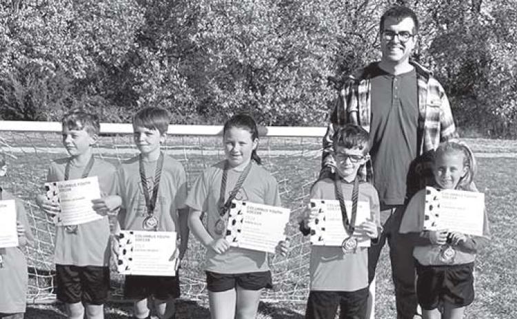 Two teams tied for first place honors in the seven and eight-year-old division of Columbus Youth Soccer League. The Calibrated/Folder Express team, coached by Brian Martin and Clint Ellis received their certificates and medals during the ceremony on the final day of games in October on Froebe Fields in Eddington Park. Team members are: Ezra Crozier, Wren Ellis, Harlee Fleming, Daygin Frobish, Kannon Kitterman, Jordan Lackamp, Camden Martin, and Oakleigh Mays. Courtesy photo.