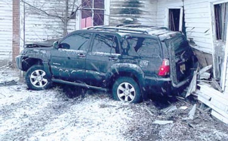 Snow and slick roads contributed to this accident Thursday evening. The driver lost control and spun into Blue Mound Church on Highway 166. Courtesy photo.