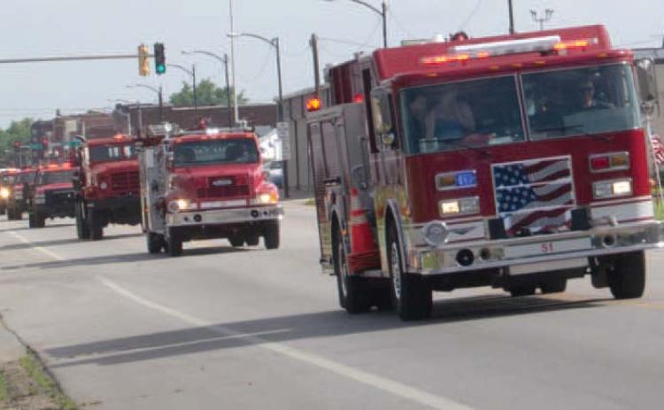 Early Saturday morning the Baxter Springs Fire Trucks formed a parade and moved down Military Avenue to their new home.