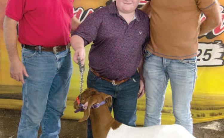 Easton Haywood, son of Kyle and Megan Haywood received a $3,000 premium bid from Draeger Farms after showing his Grand Champion Market Goat. Easton is a member of the Lone Elm Beavers 4-H Club.